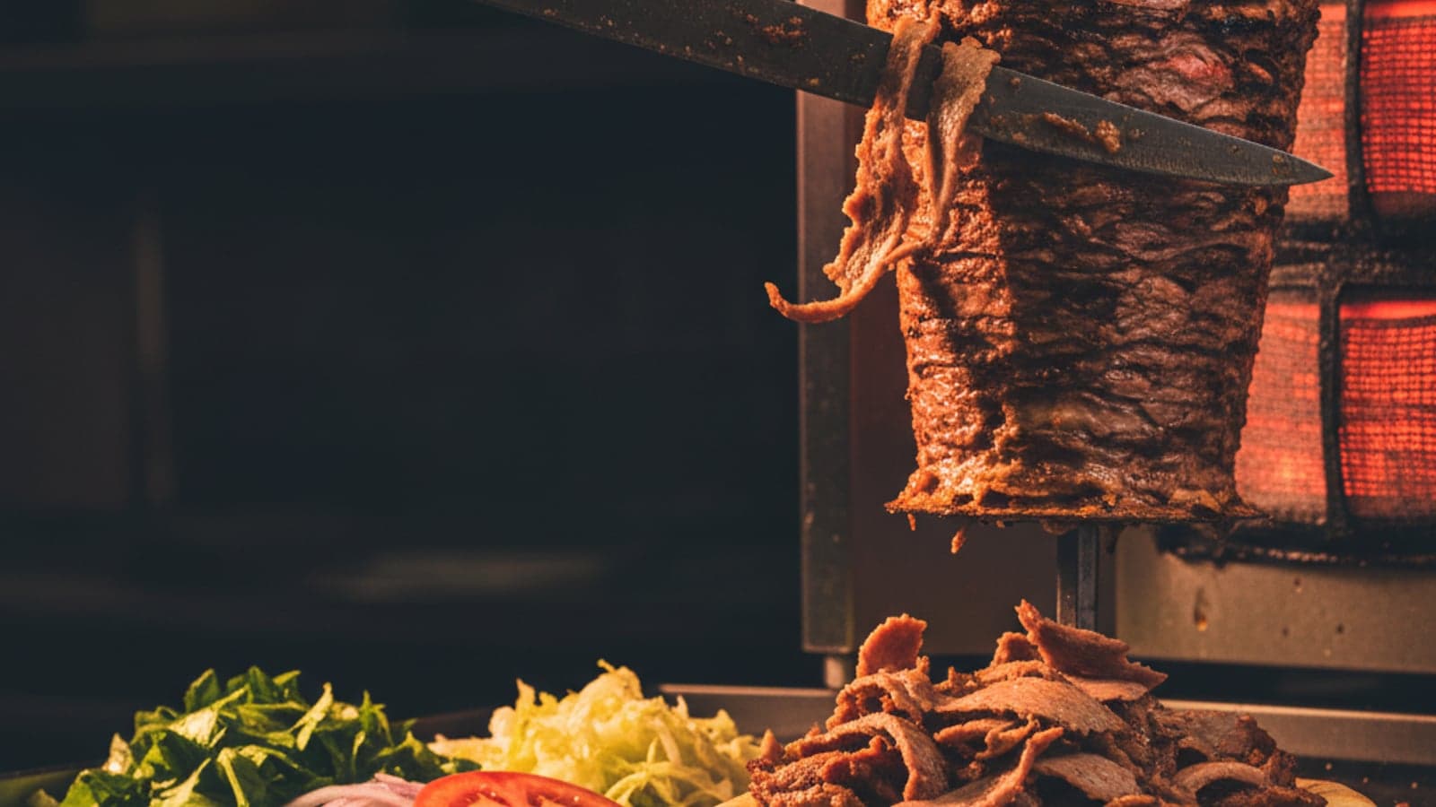 Halal doner kebab being carved fresh from the spit at Bucknall Express in Stoke-on-Trent